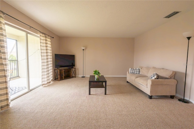 living room with baseboards, carpet flooring, and visible vents