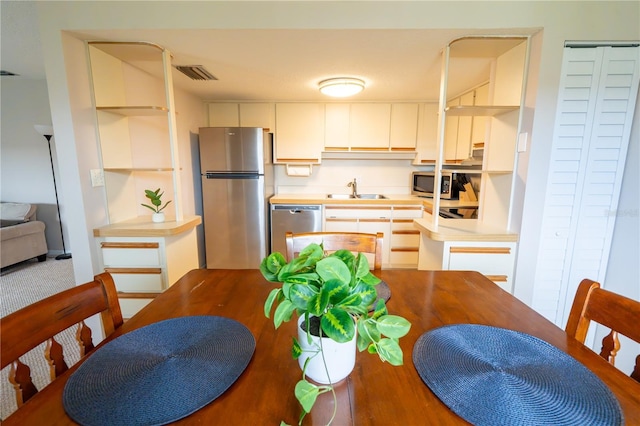 dining space featuring visible vents and wood finished floors