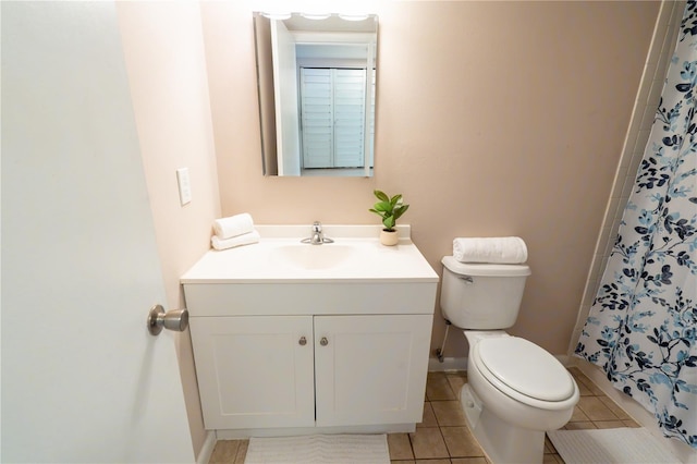 bathroom with toilet, tile patterned flooring, vanity, and a shower with curtain