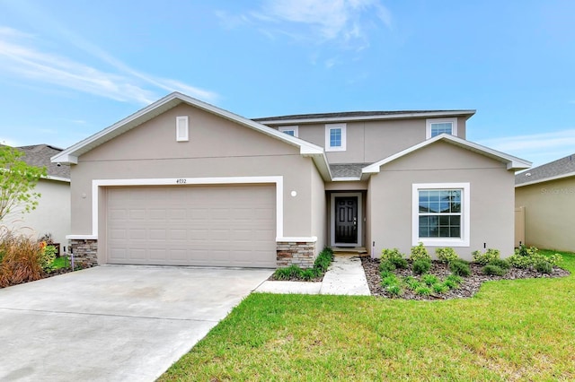 4792 Vellacito Way, Davenport, FL 33897 - view of front facade featuring an attached garage, stone siding, driveway, stucco siding, and a front yard