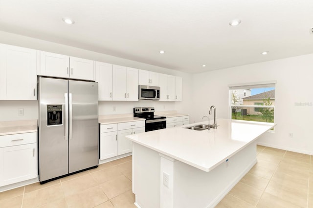 4792 Vellacito Way, Davenport, FL 33897 - kitchen with white cabinets, appliances with stainless steel finishes, light tile patterned floors, and a sink