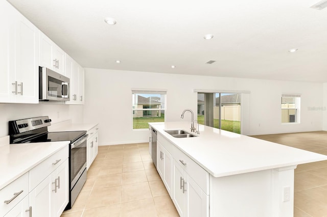 4792 Vellacito Way, Davenport, FL 33897 - kitchen featuring light tile patterned floors, a sink, stainless steel appliances, visible vents, and light countertops