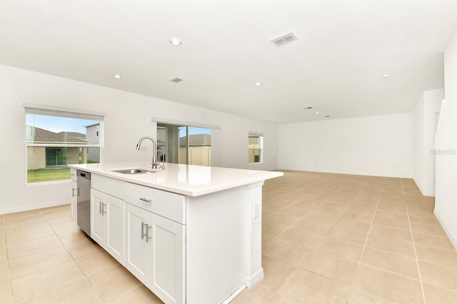 4792 Vellacito Way, Davenport, FL 33897 - kitchen featuring an island with sink, a healthy amount of sunlight, visible vents, and a sink