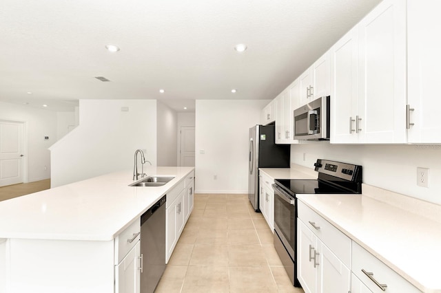 4792 Vellacito Way, Davenport, FL 33897 - kitchen featuring a sink, recessed lighting, an island with sink, light tile patterned floors, and appliances with stainless steel finishes