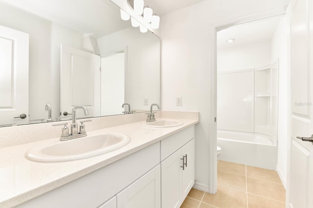 4792 Vellacito Way, Davenport, FL 33897 - bathroom featuring a sink, double vanity, toilet, and tile patterned floors