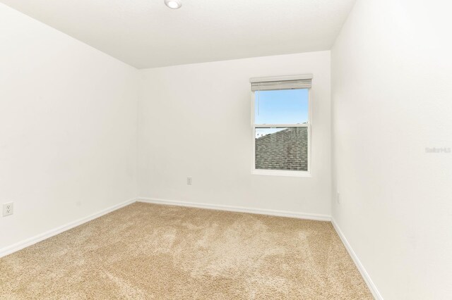 4792 Vellacito Way, Davenport, FL 33897 - unfurnished room with baseboards and light colored carpet