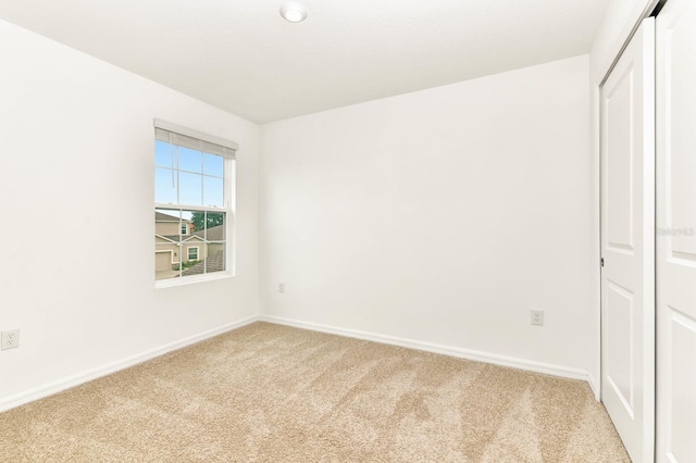 4792 Vellacito Way, Davenport, FL 33897 - unfurnished bedroom featuring a closet, light carpet, and baseboards