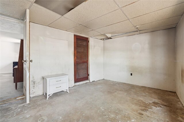 interior space featuring a drop ceiling