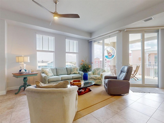 5 Riverwalk Dr Unit 601, New Smyrna Beach, FL 32169 - living area with light tile patterned flooring, a ceiling fan, and baseboards