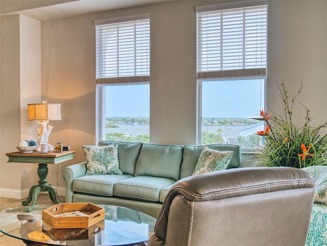 5 Riverwalk Dr Unit 601, New Smyrna Beach, FL 32169 - living area featuring baseboards and a high ceiling