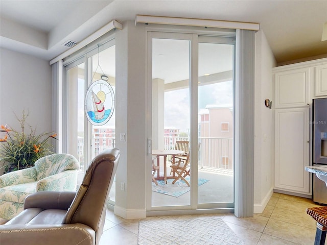 5 Riverwalk Dr Unit 601, New Smyrna Beach, FL 32169 - doorway with light tile patterned flooring and baseboards