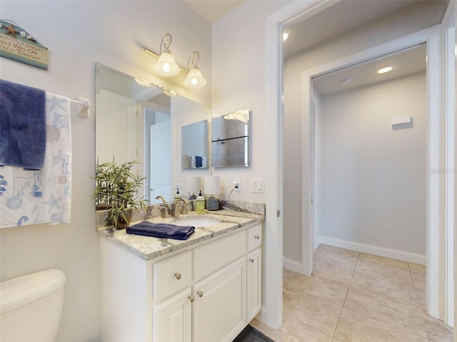 5 Riverwalk Dr Unit 601, New Smyrna Beach, FL 32169 - bathroom featuring toilet, tile patterned flooring, vanity, and baseboards
