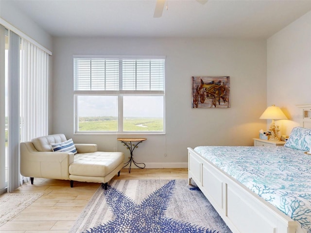 5 Riverwalk Dr Unit 601, New Smyrna Beach, FL 32169 - bedroom featuring light wood finished floors, ceiling fan, and baseboards