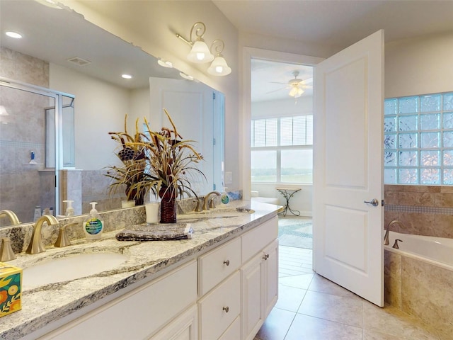 5 Riverwalk Dr Unit 601, New Smyrna Beach, FL 32169 - full bath with tile patterned floors, ceiling fan, a stall shower, double vanity, and a bath