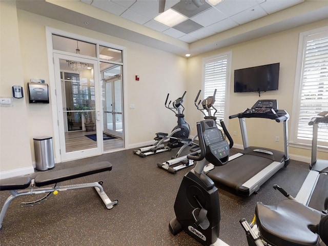 5 Riverwalk Dr Unit 601, New Smyrna Beach, FL 32169 - workout area featuring baseboards, a paneled ceiling, and french doors