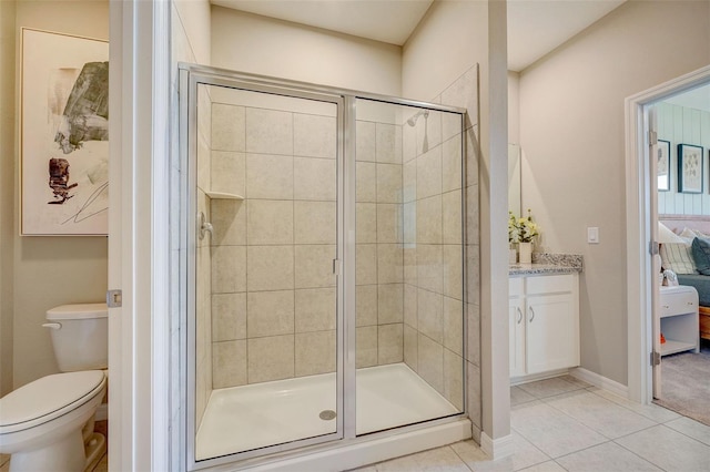 ensuite bathroom with ensuite bath, tile patterned flooring, a stall shower, and toilet