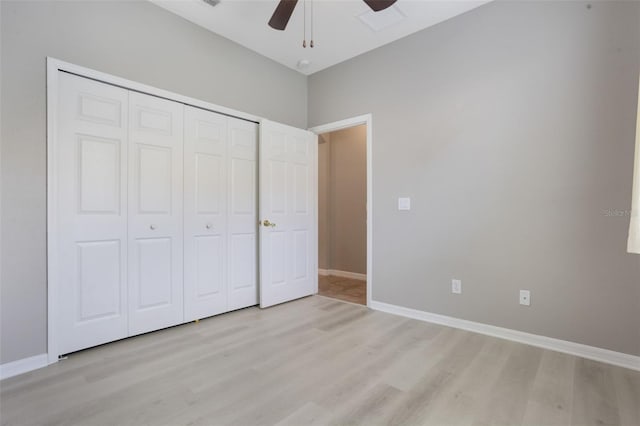 3436 Gerber Daisy Ln, Oviedo, FL 32766 - unfurnished bedroom featuring light wood-style flooring, a closet, baseboards, and ceiling fan