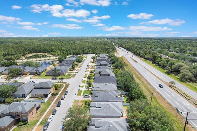 3436 Gerber Daisy Ln, Oviedo, FL 32766 - aerial view featuring a view of trees and a residential view