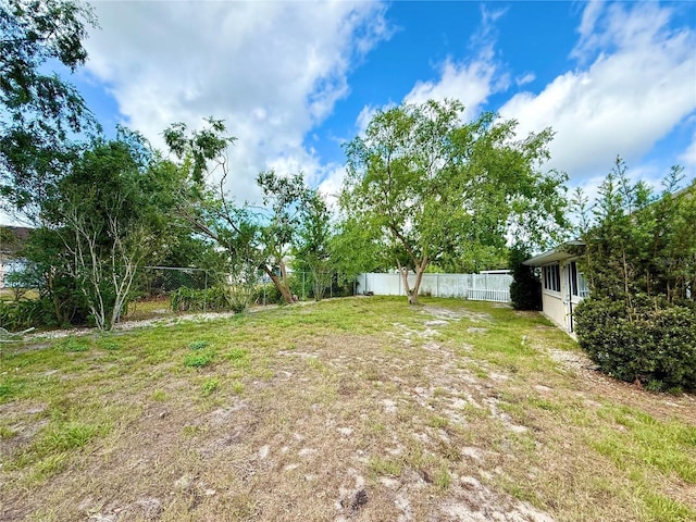 view of yard with a fenced backyard