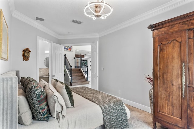 bedroom featuring crown molding and baseboards