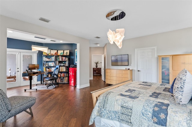 bedroom with wood finished floors, french doors, and baseboards
