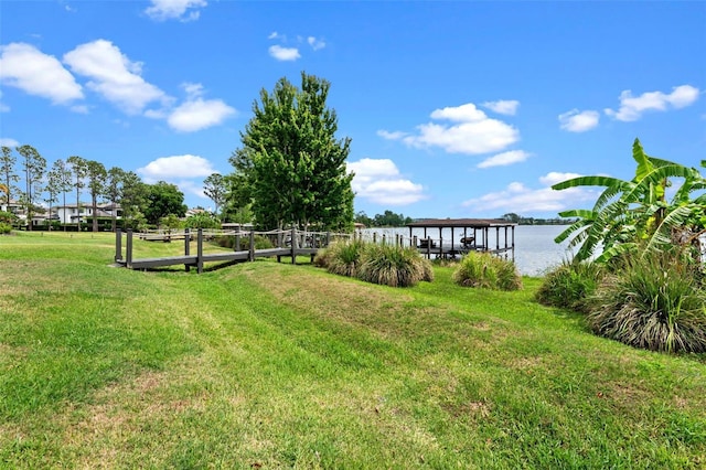 view of grassy yard with a water view