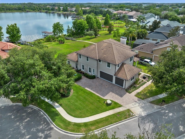 aerial perspective of suburban area with a nearby body of water