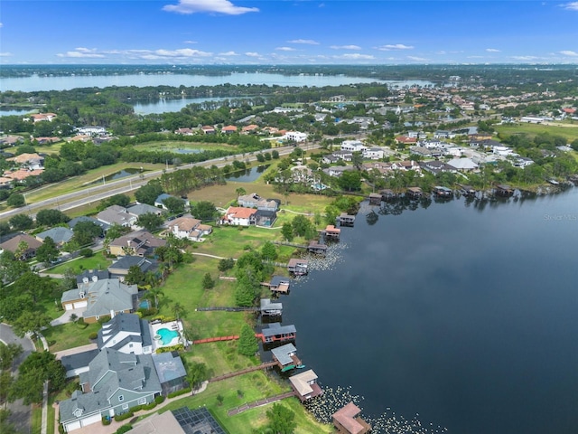 aerial overview of property's location with a large body of water and nearby suburban area