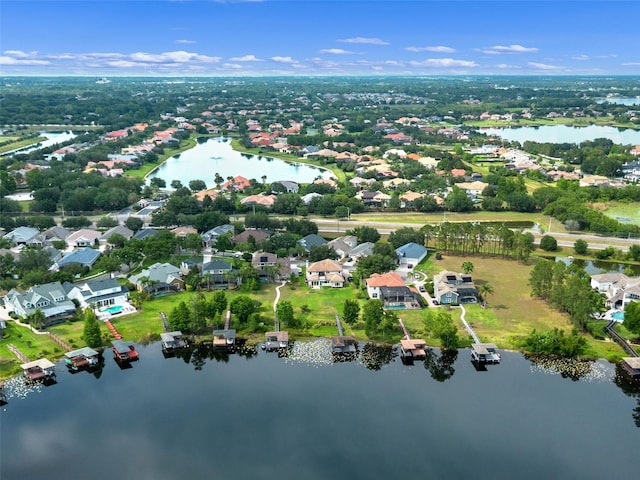 aerial view of residential area featuring a nearby body of water