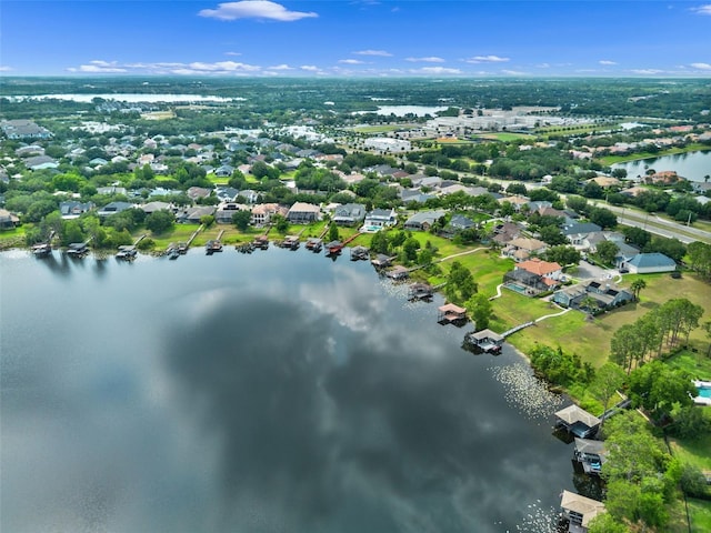 aerial overview of property's location with a large body of water and nearby suburban area