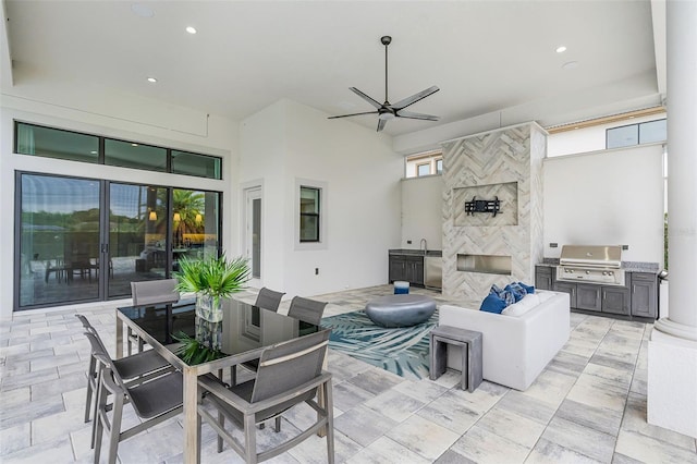 view of patio with area for grilling, outdoor dining area, and outdoor lounge area
