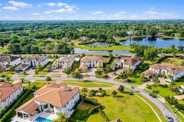 aerial view of residential area with a large body of water