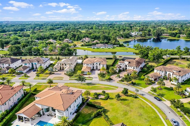aerial view of residential area featuring a nearby body of water