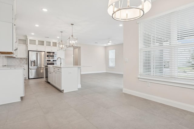 13187 Telsen St Unit 38, Winter Garden, FL 34787 - kitchen featuring high end fridge, a chandelier, light countertops, tasteful backsplash, and recessed lighting