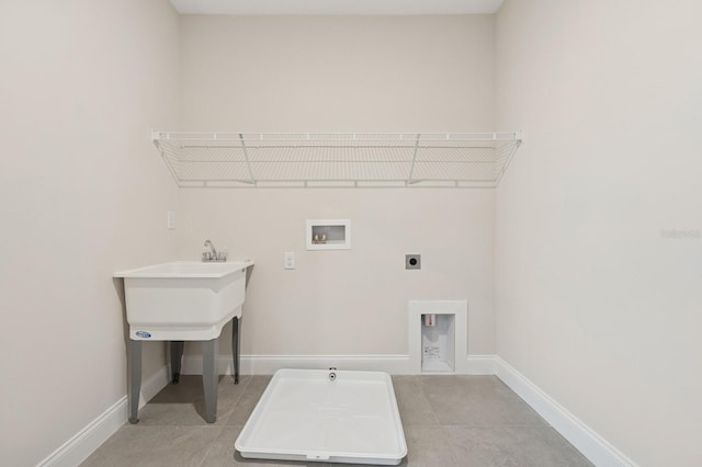 13187 Telsen St Unit 38, Winter Garden, FL 34787 - washroom featuring hookup for a washing machine, electric dryer hookup, light tile patterned flooring, and gas dryer hookup