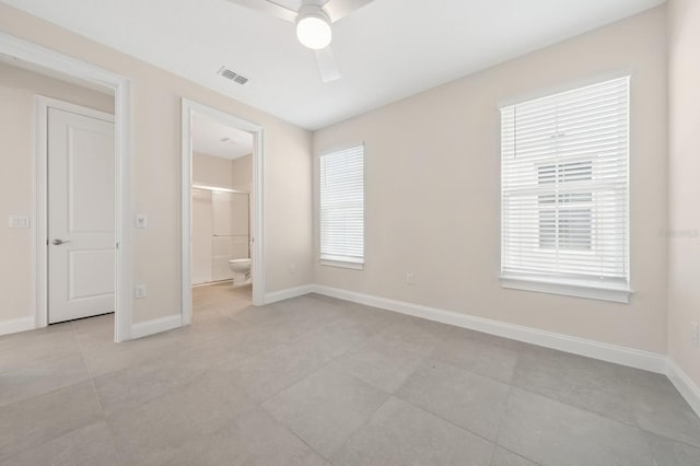 13187 Telsen St Unit 38, Winter Garden, FL 34787 - unfurnished bedroom with ensuite bath, light tile patterned floors, and ceiling fan