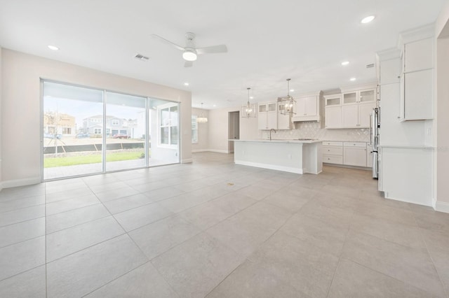 13187 Telsen St Unit 38, Winter Garden, FL 34787 - unfurnished living room featuring ceiling fan, recessed lighting, and light tile patterned floors
