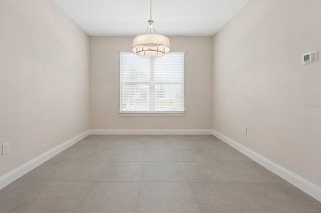 13187 Telsen St Unit 38, Winter Garden, FL 34787 - spare room with a chandelier and light tile patterned floors