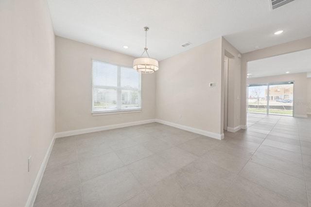 13187 Telsen St Unit 38, Winter Garden, FL 34787 - spare room with recessed lighting, light tile patterned floors, and a chandelier