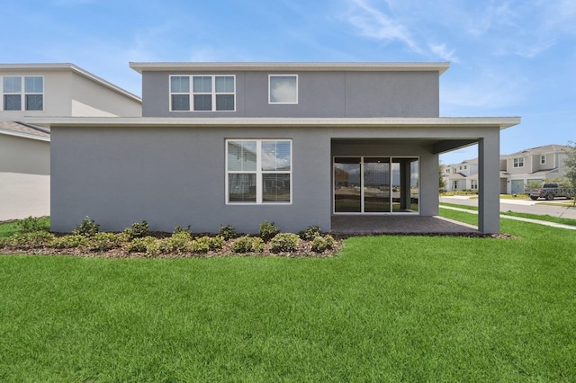 13187 Telsen St Unit 38, Winter Garden, FL 34787 - back of property with a lawn and stucco siding