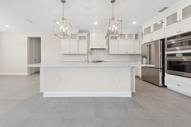 13187 Telsen St Unit 38, Winter Garden, FL 34787 - kitchen with appliances with stainless steel finishes, a chandelier, decorative backsplash, light countertops, and recessed lighting