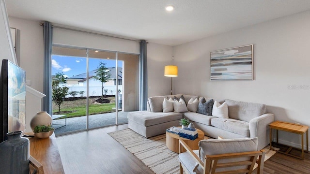 living room featuring recessed lighting and wood finished floors
