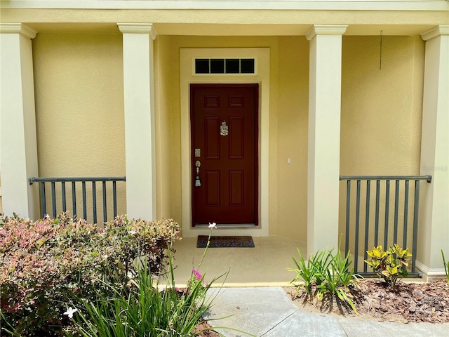 30732 Lipizzan Ter, Mount Dora, FL 32757 - doorway to property featuring stucco siding