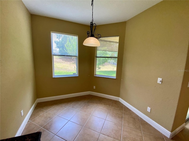 30732 Lipizzan Ter, Mount Dora, FL 32757 - unfurnished dining area with tile patterned flooring and baseboards