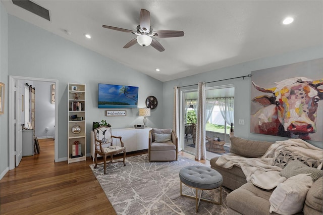 living room featuring vaulted ceiling, wood finished floors, ceiling fan, recessed lighting, and baseboards