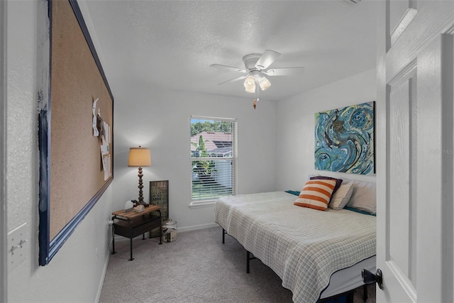 bedroom featuring carpet, baseboards, and ceiling fan