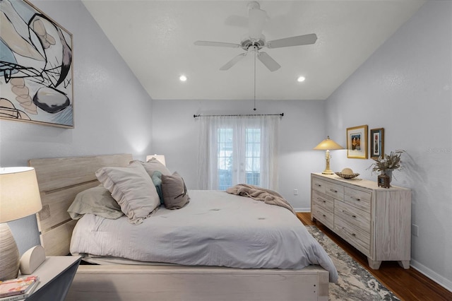 bedroom featuring dark wood-type flooring, baseboards, lofted ceiling, a ceiling fan, and recessed lighting