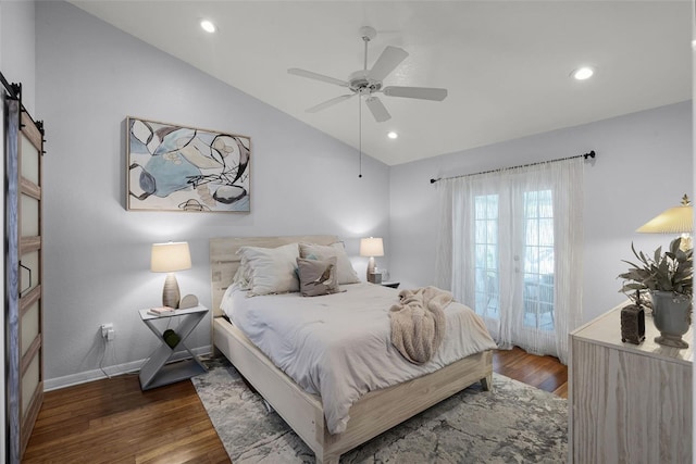 bedroom with vaulted ceiling, wood finished floors, recessed lighting, a ceiling fan, and a barn door