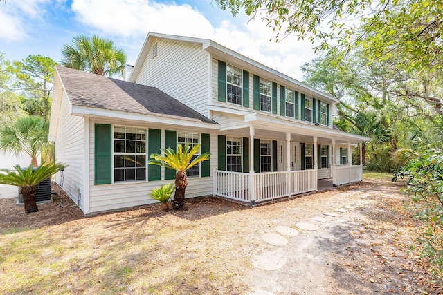 2320 Red Ember Rd, Oviedo, FL 32765 - rear view of house with a porch and roof with shingles