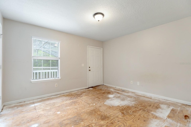 2320 Red Ember Rd, Oviedo, FL 32765 - spare room featuring baseboards and a textured ceiling